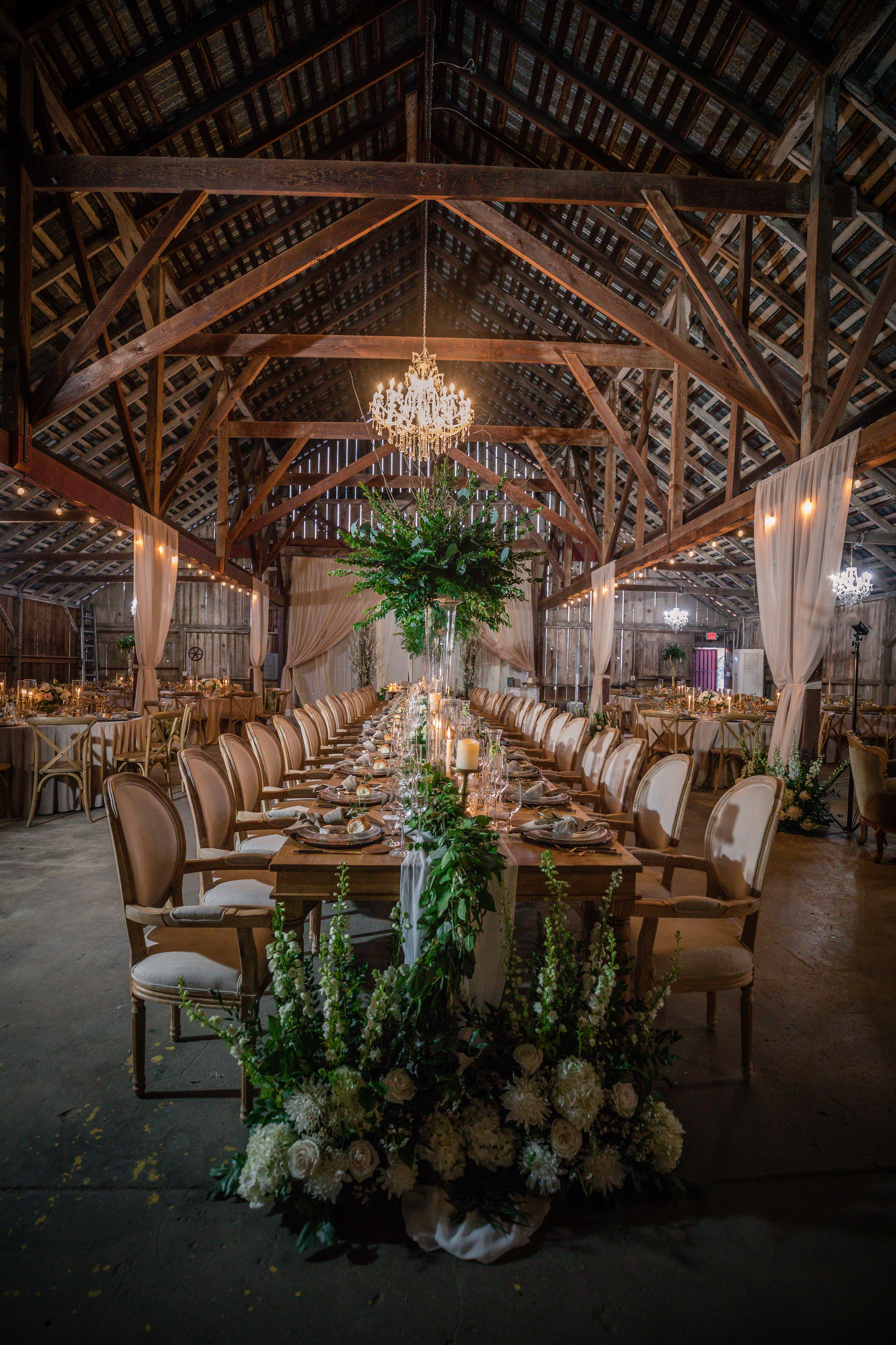 Elegant barn reception decoration in rustic barn.