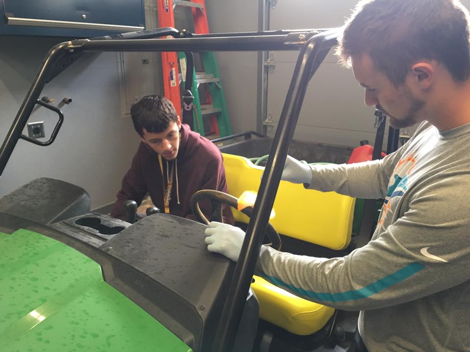 Students learn how to maintain an offload vehicle.