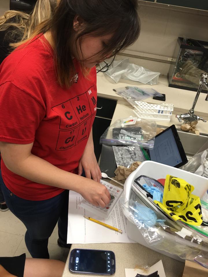 Science student working on her lab project.