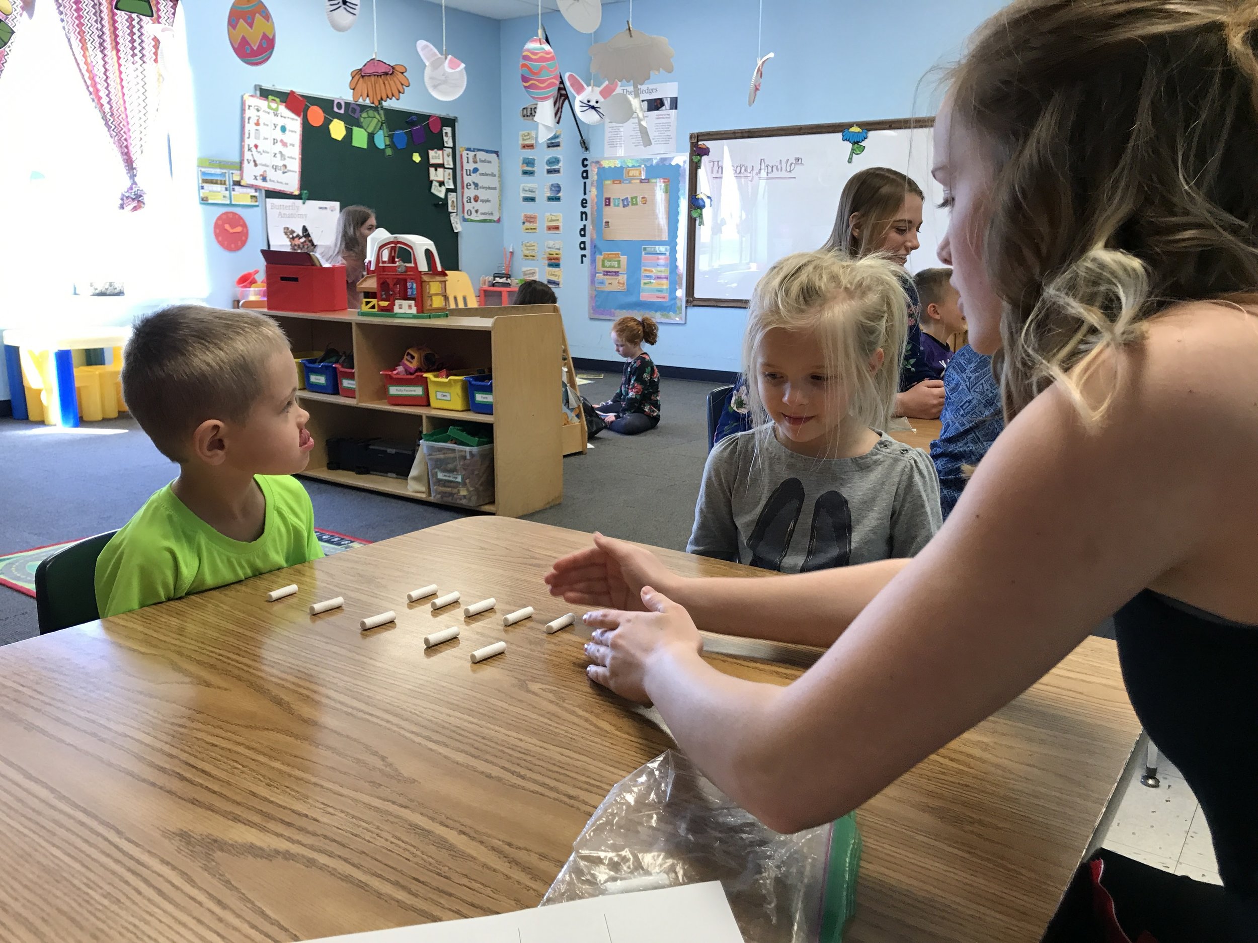 Student interacts with Elementary School Children