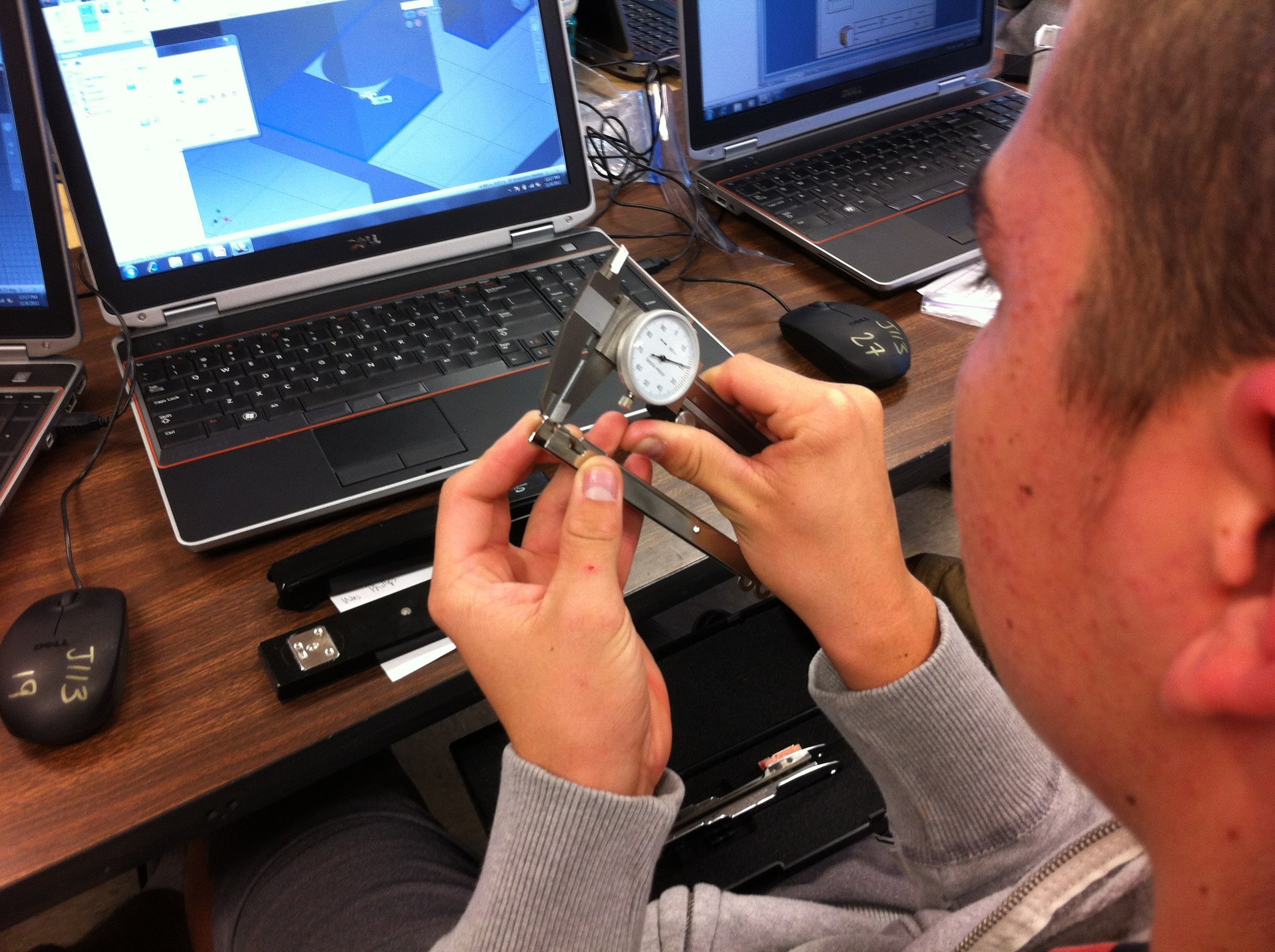 Engineering Student measures an object