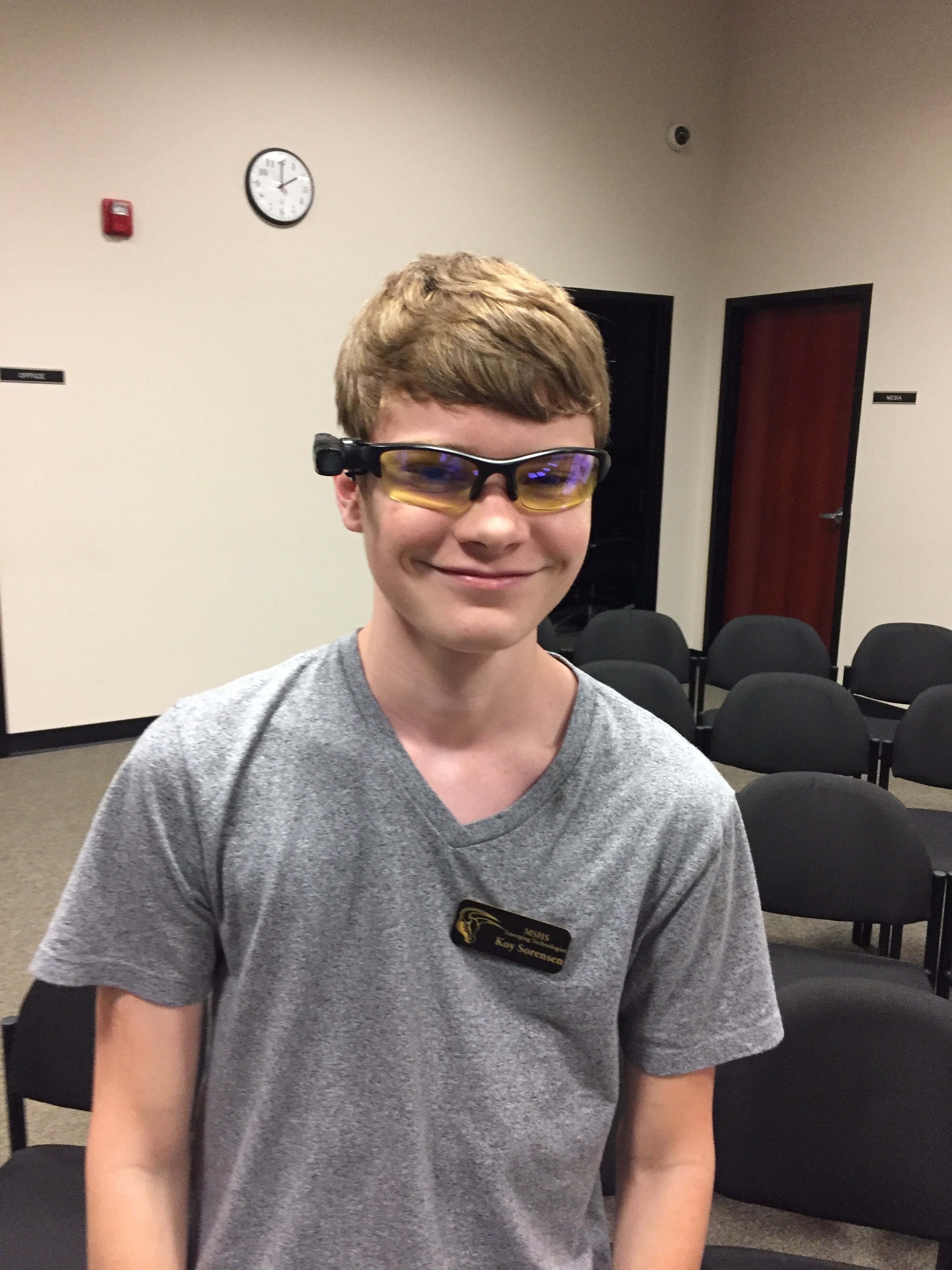 Emerging Tech student tries on Police glasses camera.
