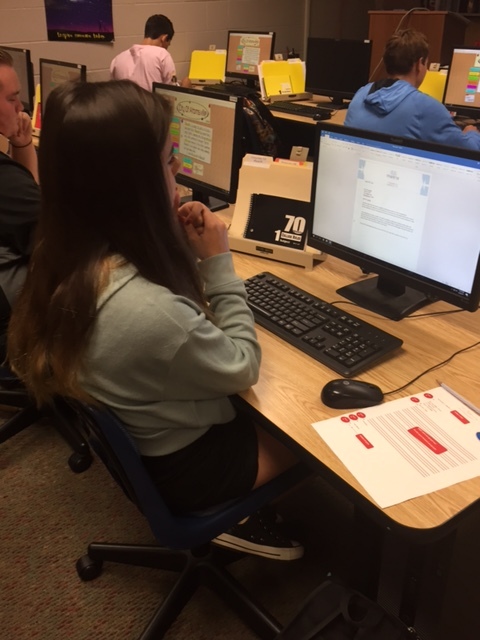 Business Communication student works on her business document.