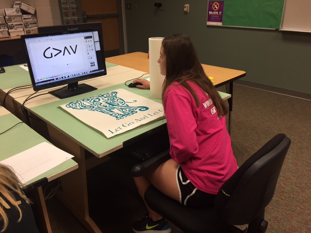 Graphic Design student works on her design.