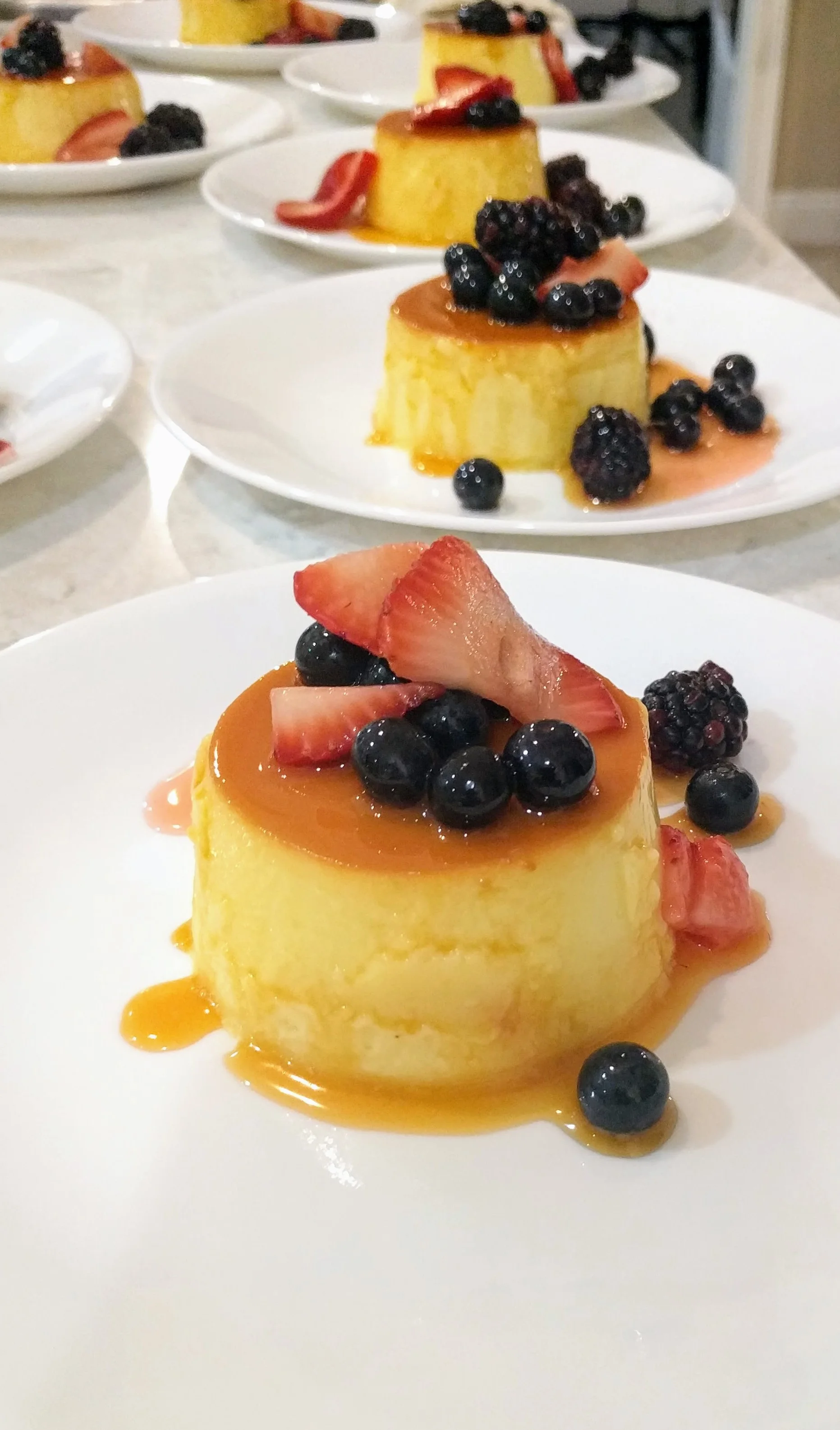 White Chocolate Creme Caramel with Fresh Berries.