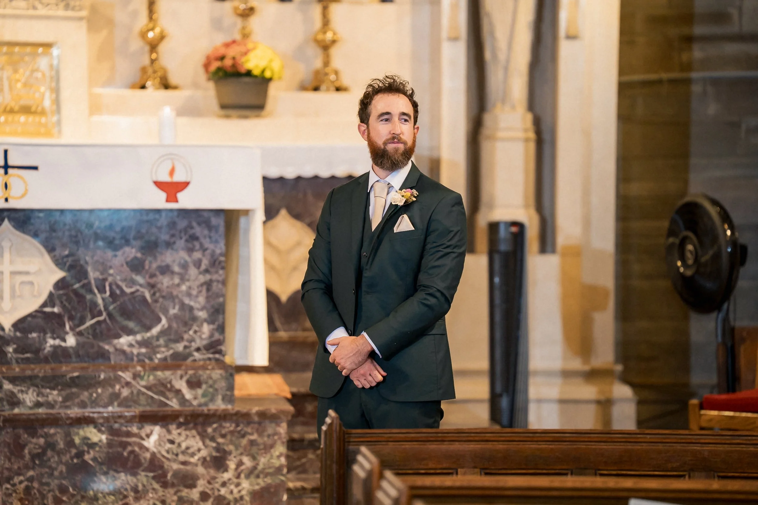 11-groom-waiting-at-altar-holy-cross-church.jpg