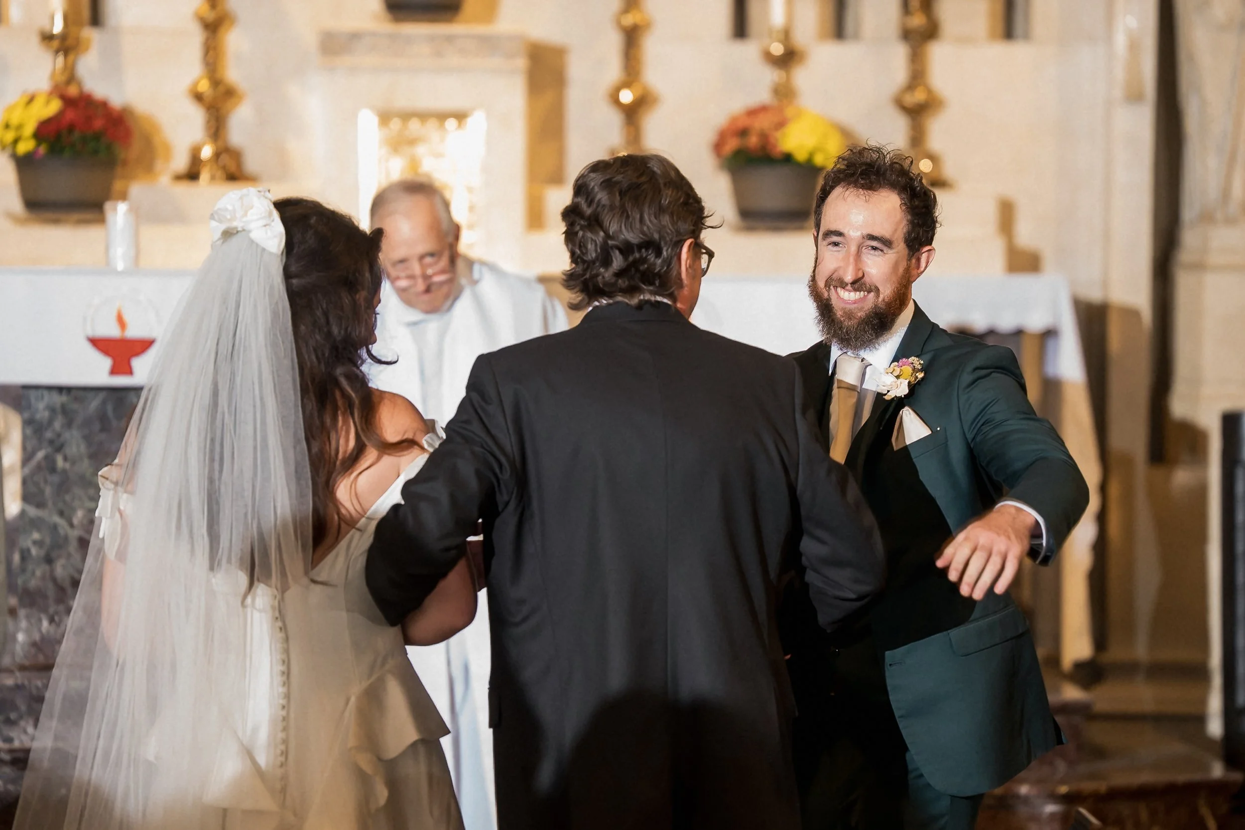 14-father-greets-groom-at-catholic-wedding.jpg
