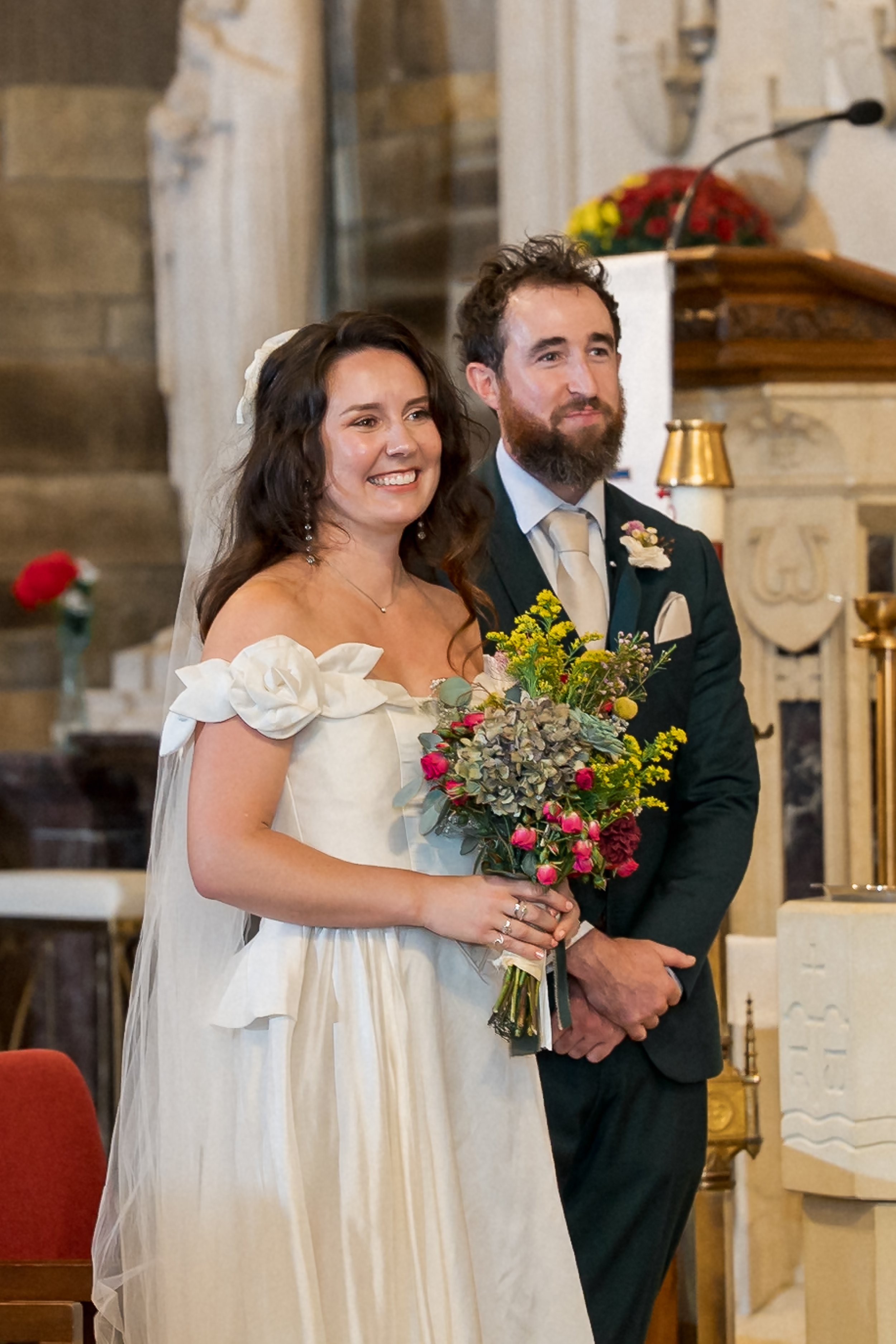 15-bride-and-groom-at-holy-cross-altar.jpg