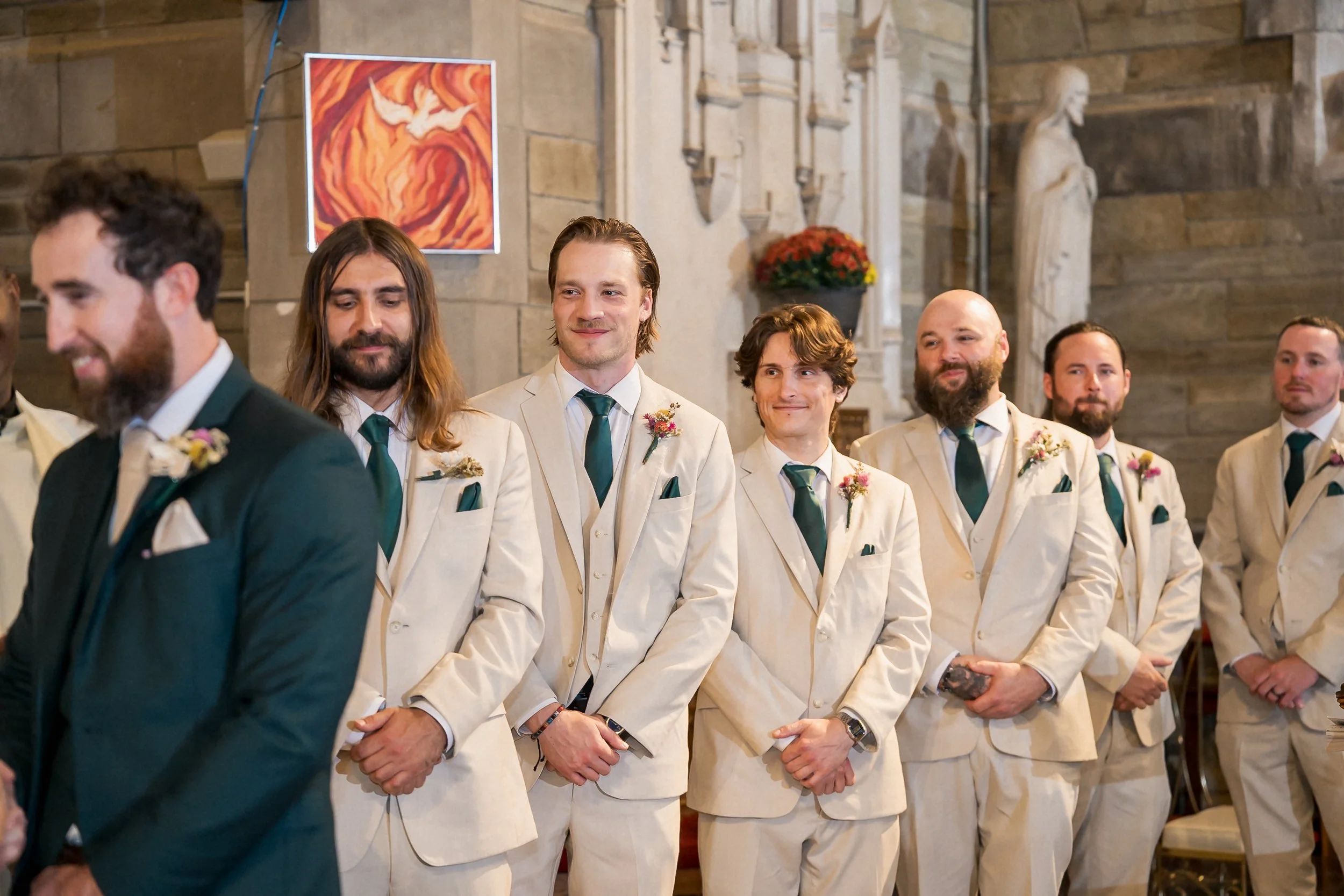 22-groomsmen-tan-suits-during-church-wedding.jpg