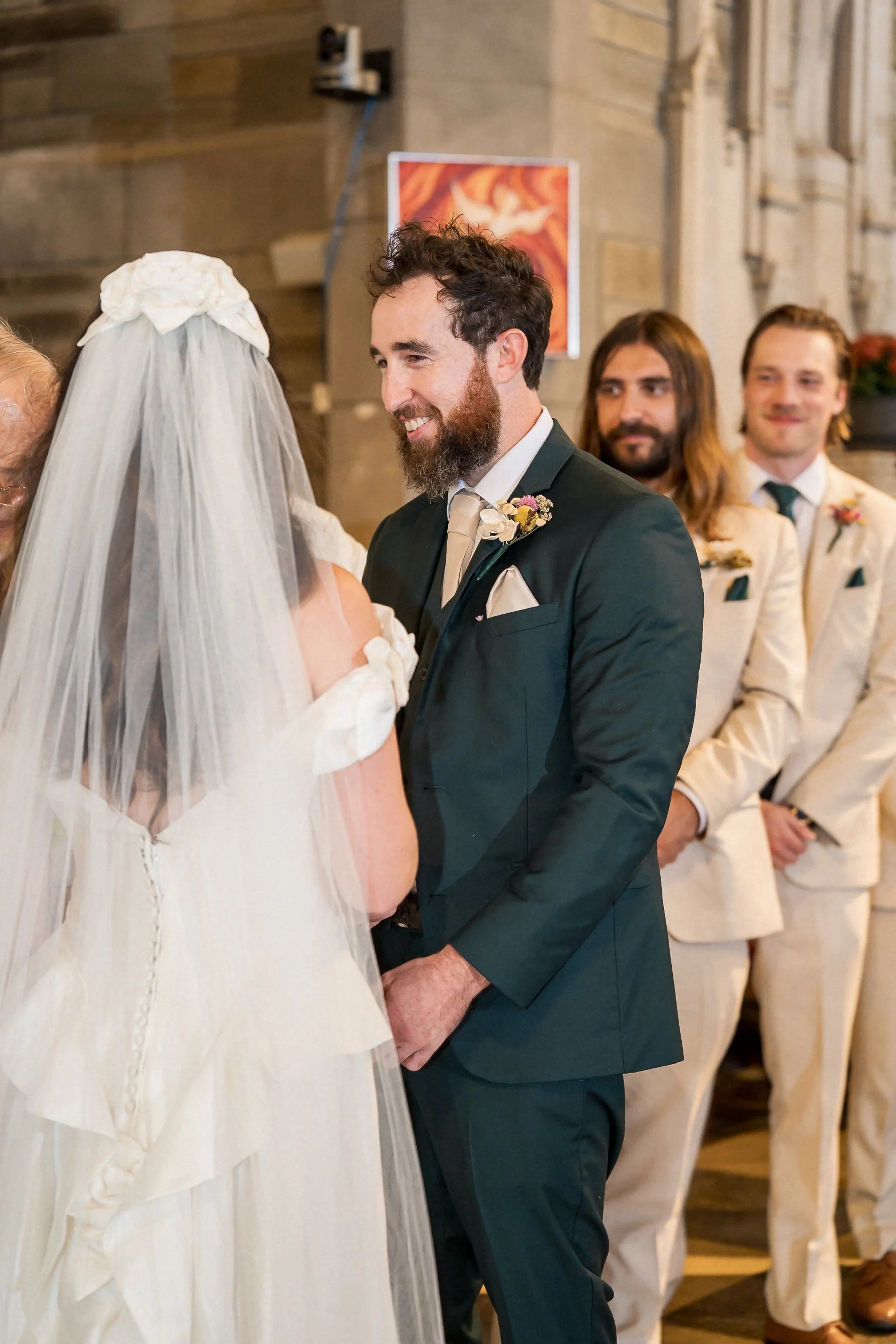 23-groom-smiling-at-bride-during-vows.jpg