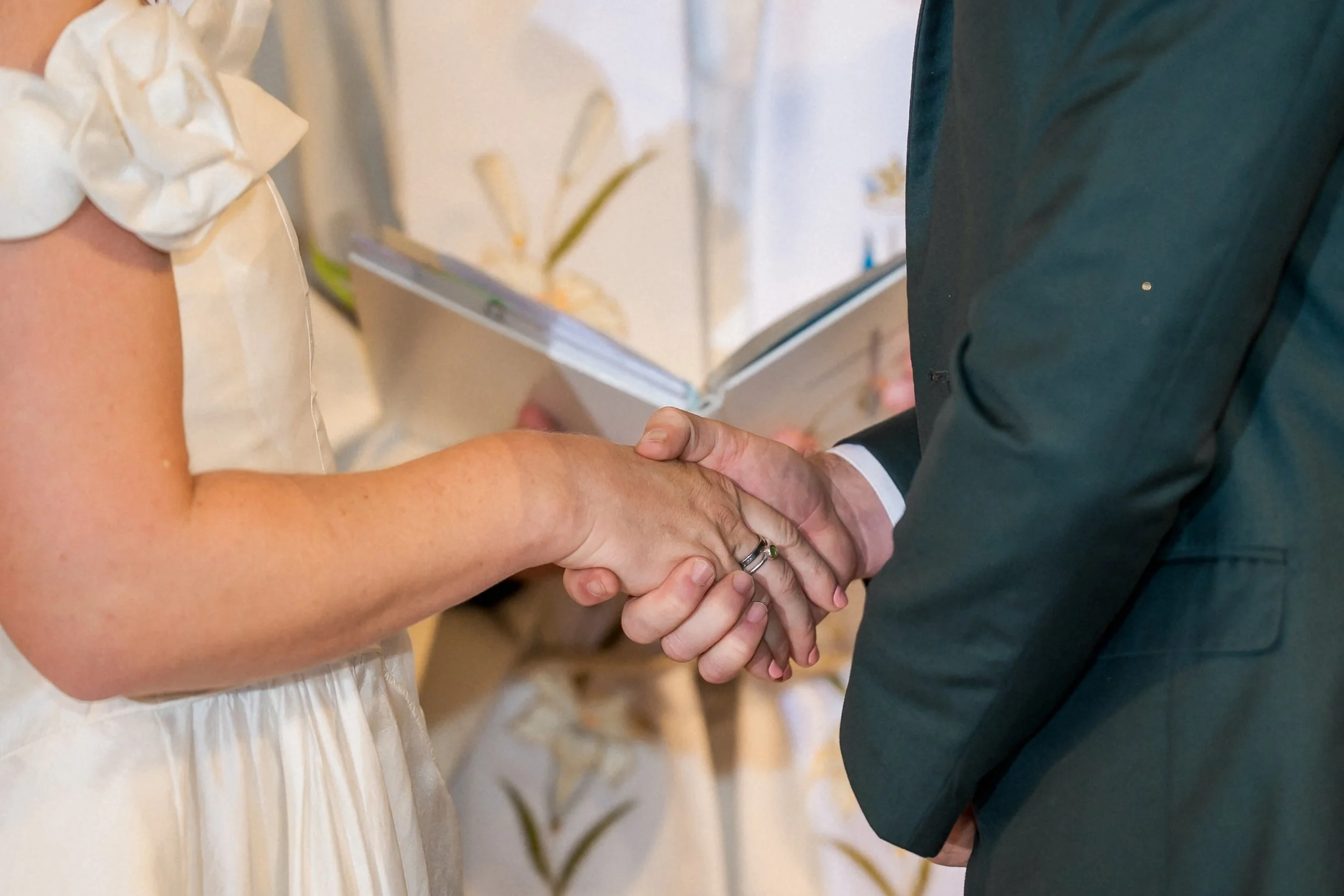24-couple-holding-hands-catholic-wedding-vows.jpg