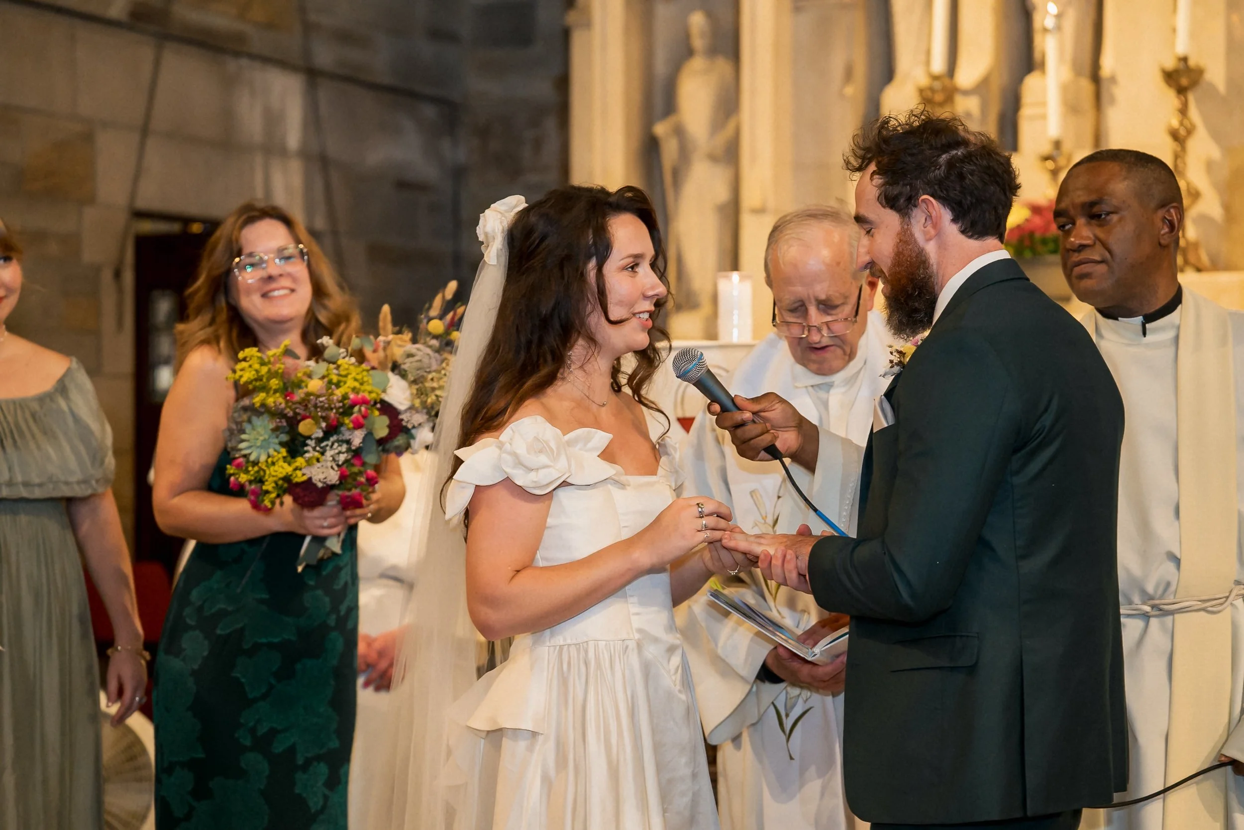 25-bride-placing-wedding-ring-on-groom.jpg