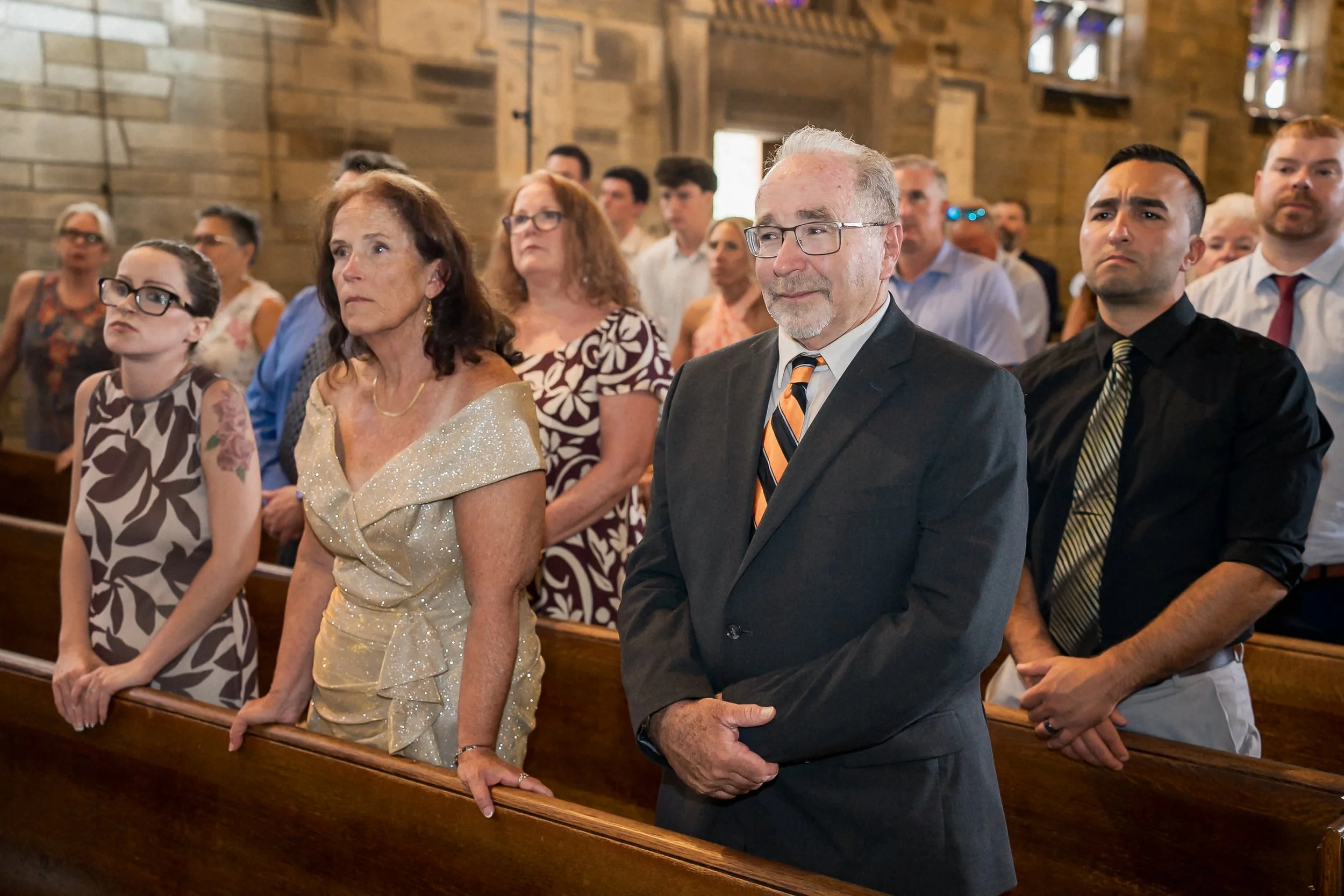 28-family-watching-catholic-wedding-ceremony.jpg