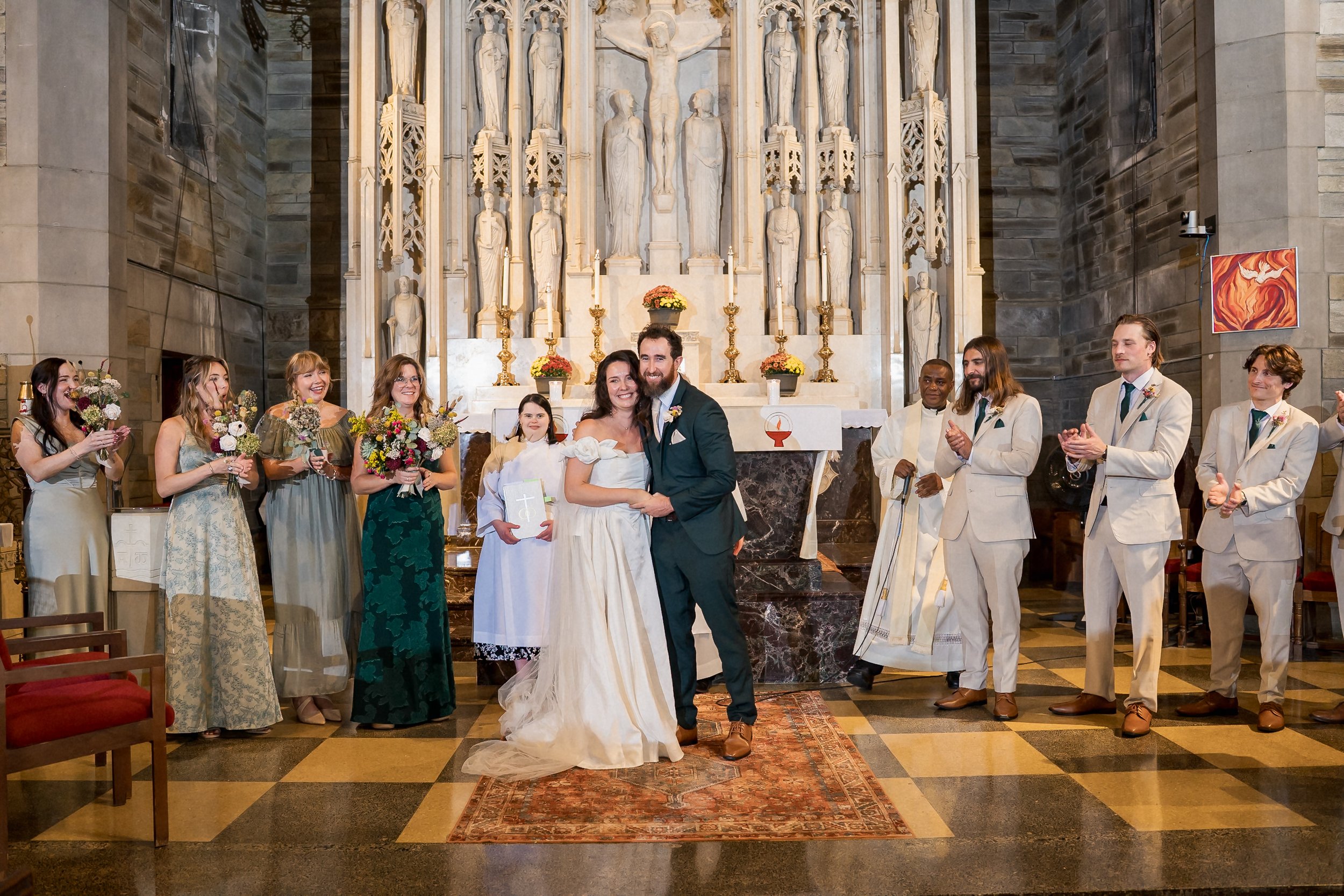 32-newlyweds-celebrate-at-holy-cross-altar.jpg