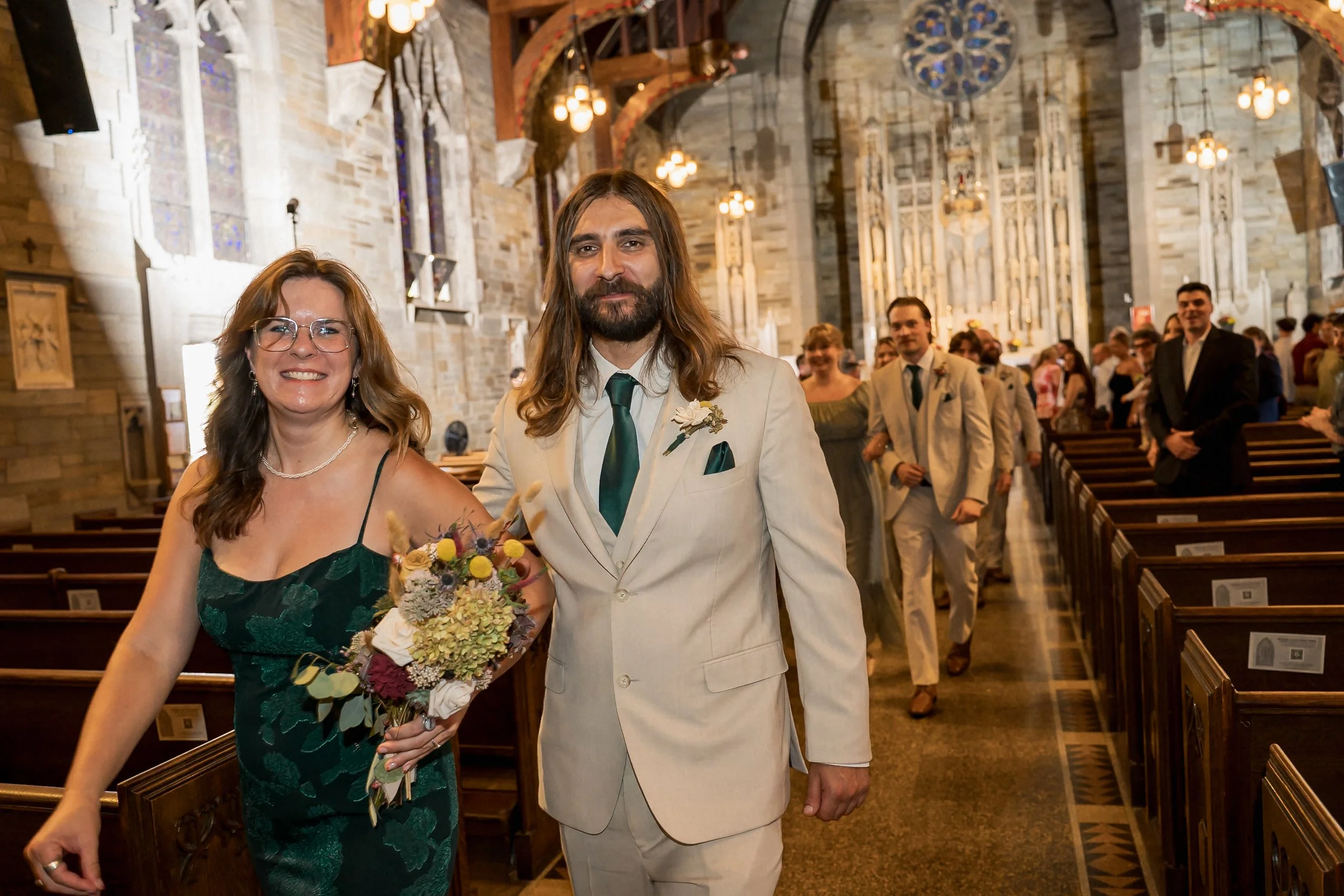36-wedding-party-walks-down-church-aisle.jpg