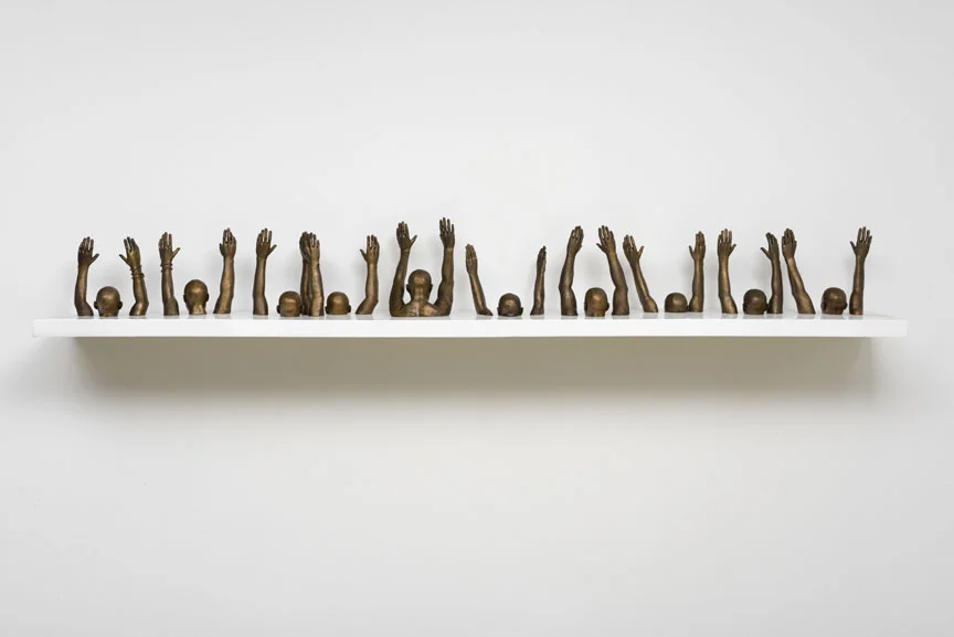 Hank Willis Thomas, Raise Up , 2013 bronze, 9.84 x 112.2 inches (25 x 285 cm) Courtesy of the artist and Jack Shainman Gallery, New York.