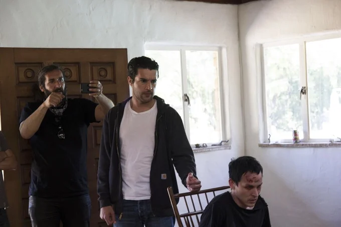 Actors Christopher Abbott and Robin Lord Taylor rehearse and block a scene for Cinematographer Carlos Veron.