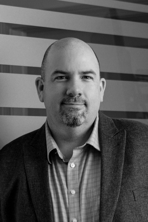 AKA Technomage As Chief Technology Officer, Sean leads the development efforts that transform the vision and architecture for the platform into reality. Sean has 20 years of software development and systems administration experience; he has investigated and responded to cyber incidents and attacks as they’ve advanced alongside cybersecurity technology. Working with David and Ben, the three launched UNB's first graduate online application system, its first mobile app and spear-headed UNB's migration of its entire student and alumni e-mail system to Microsoft's Office365. Sean is known around the office for keeping calm while he Greek yogurt’s on. He’s revered by colleagues for his efforts for securing the title of most appealing lunches laureate.