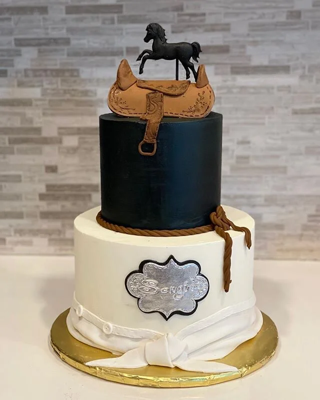 Cowboy themed caked. Buttercream cake with fondant details. .
.
.
.
.
.
.
.
#cakes #customcakes #cakeart #fondantcakes #customcake #cake #decoratedcakes #buttercreamcake #sugarart #decoratedcake #buttercreamcakes #edibleart #cowboycake #cowboythemedc
