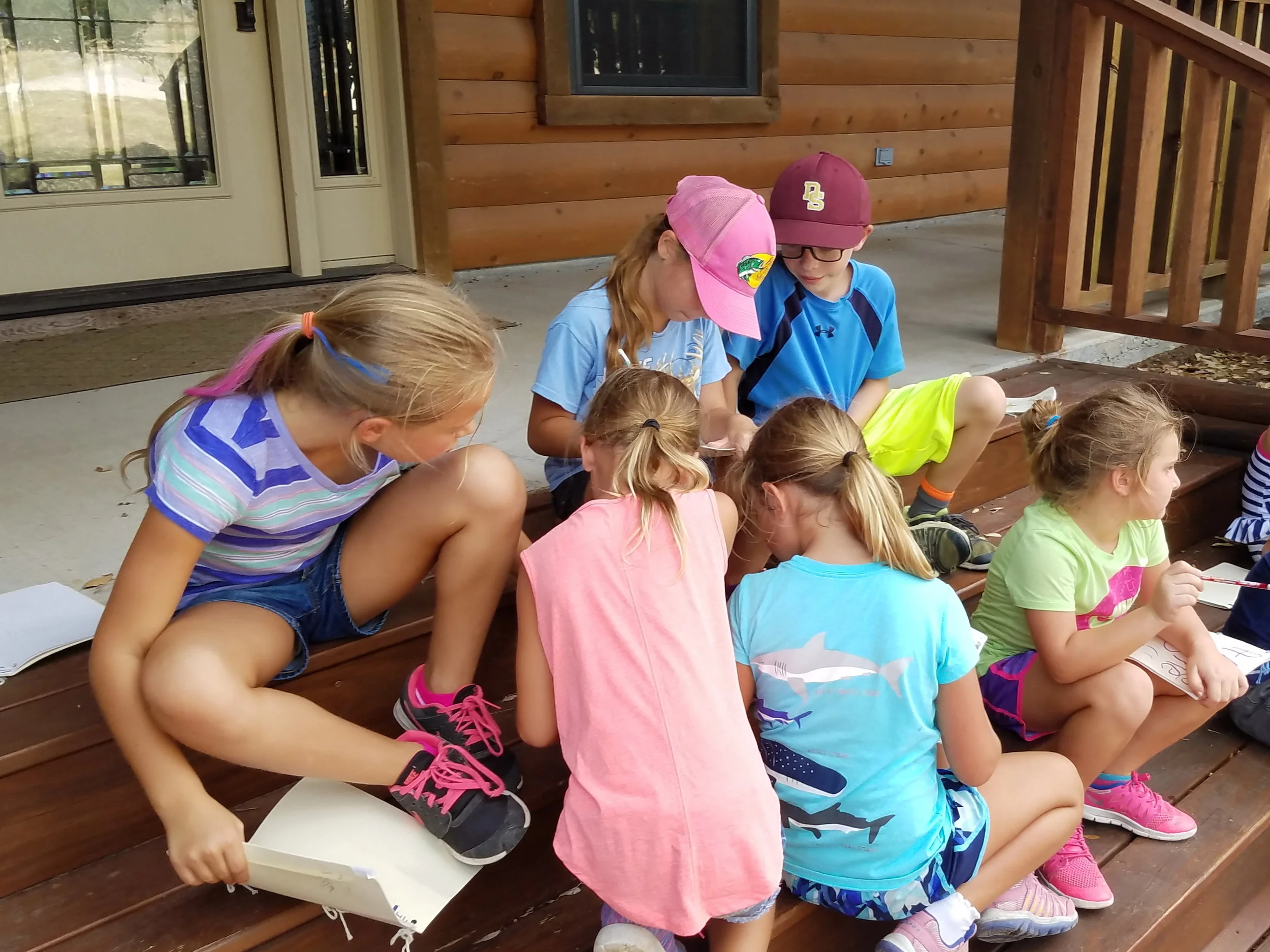 While bird watching the children kept notes of their observations in their journals.
