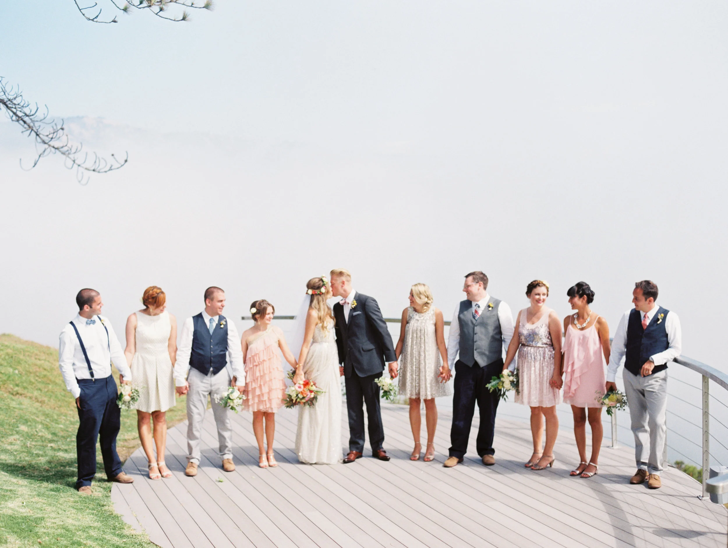 Mismatched bridesmaid dresses + groomsmen attire. Groomsmen in J crew factory, bridesmaids assorted.