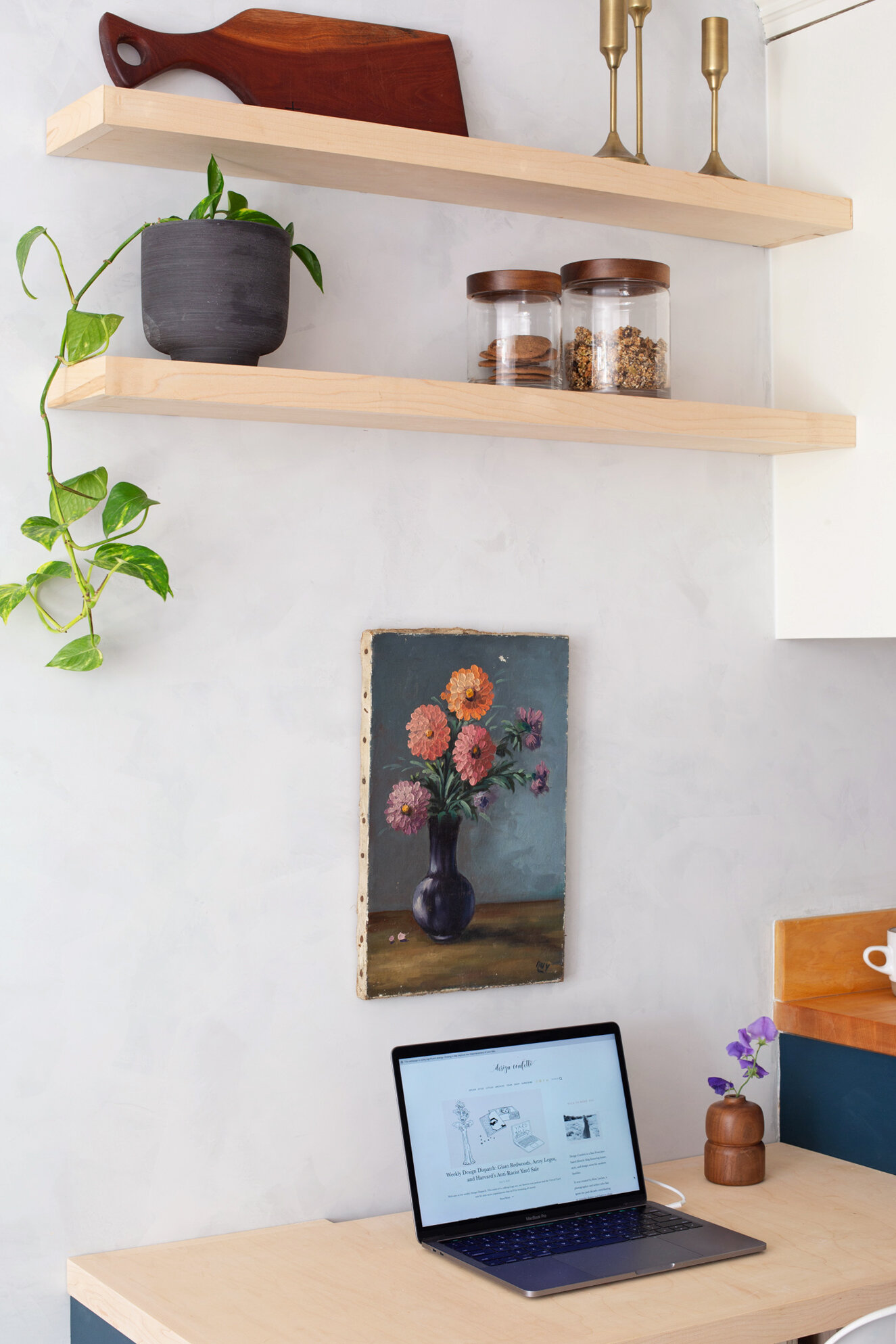  The floating shelves help to tie the kitchen and office together and create more open storage to display pretty objects. 
