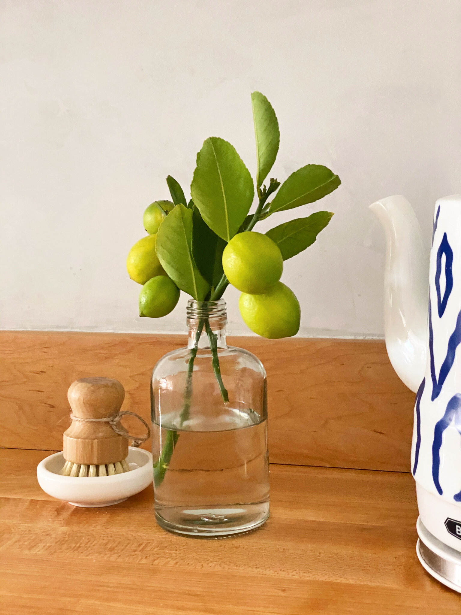  Little details like the wooden scrubber and dish and a branch of lemons are as pretty as they are practical. 