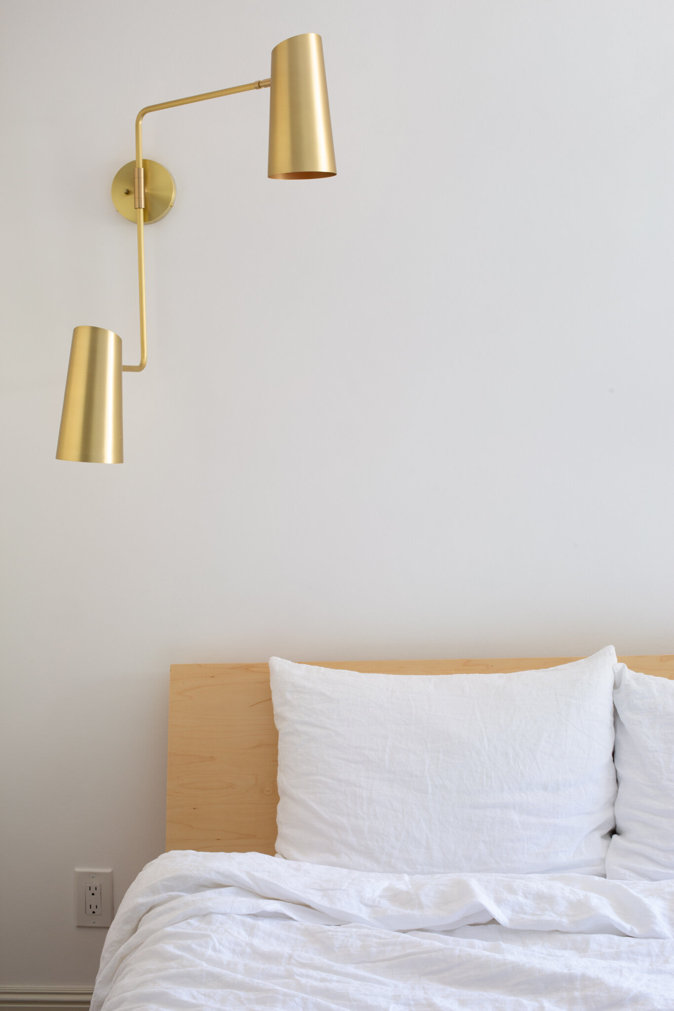  The double swing arm lamp provides reading light over the bed while staying clear of the wardrobe doors. 