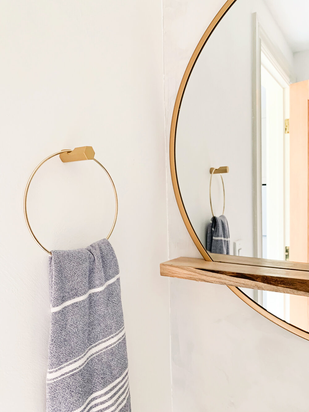  I created the towel ring out of a wall hook from Cb2 and a brass craft ring when I couldn’t find one I liked. 
