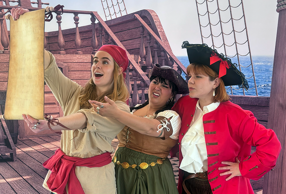 Three pirates looking at a map