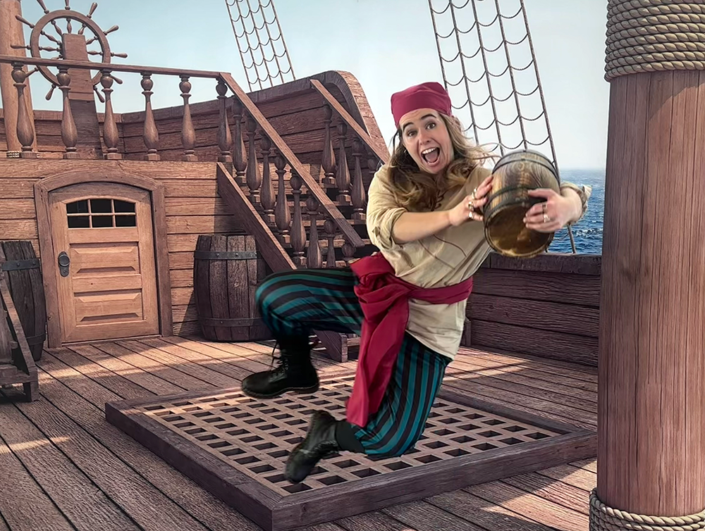 Pirate in air clicking heels and carrying small barrel