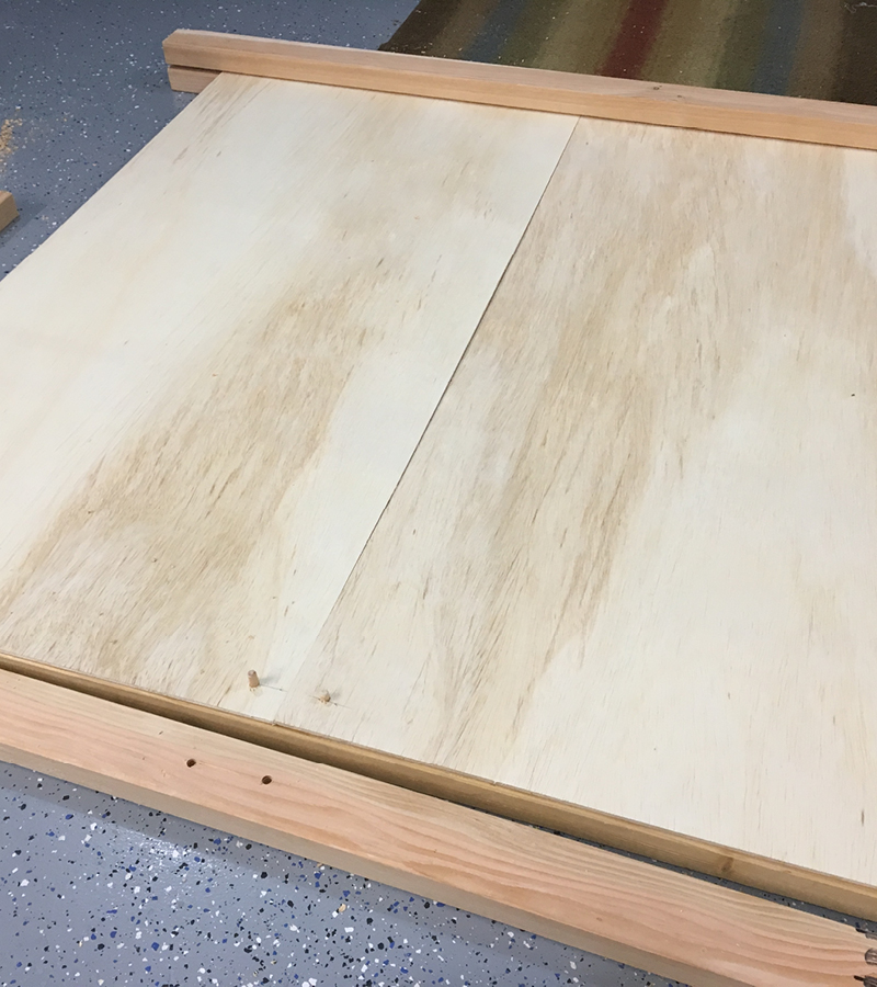 The beams without dowels sit on top and sandwich the sanded plywood.