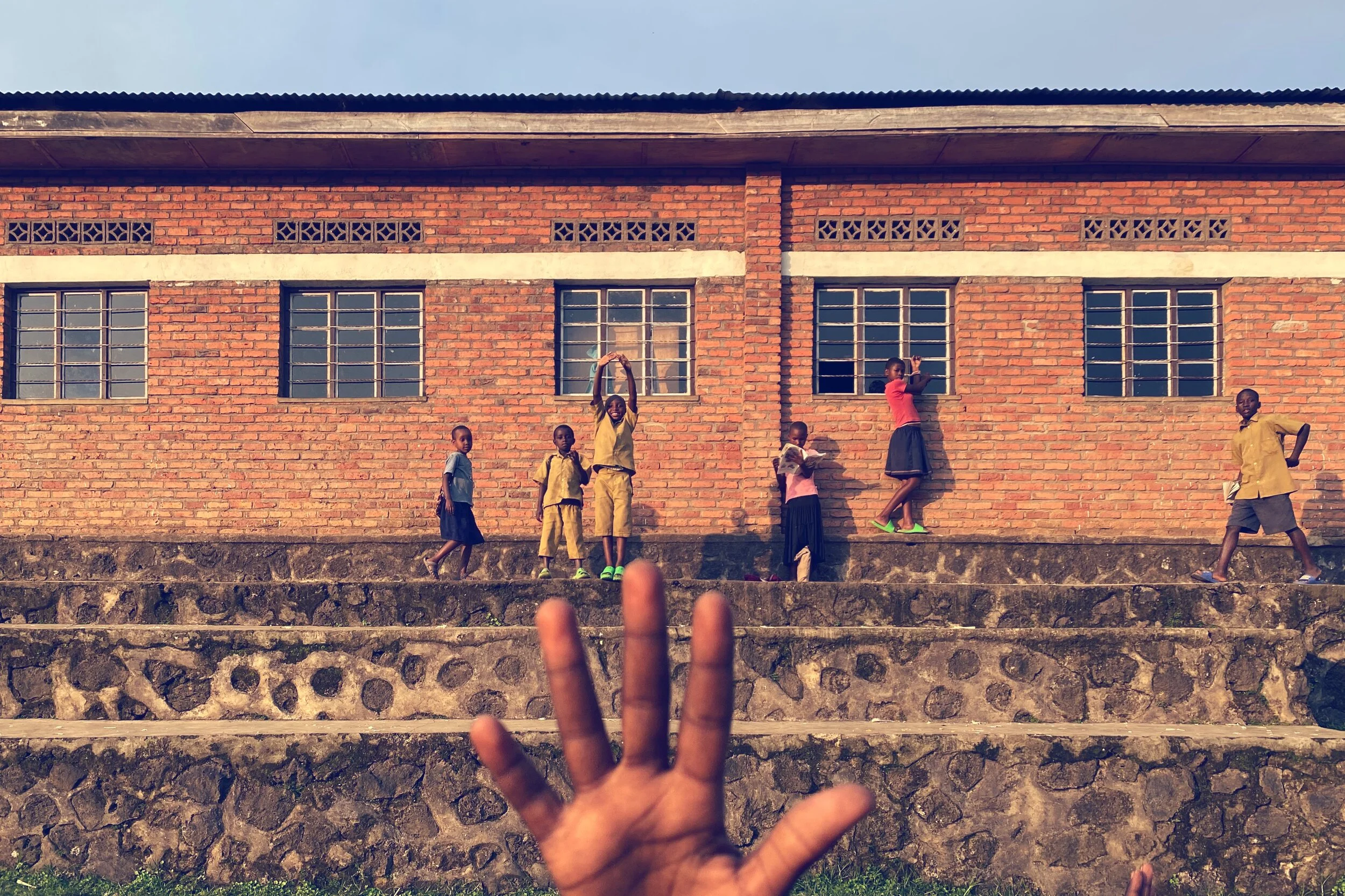 Rwanda Congo Nile Trail Kids Along Wall.JPG