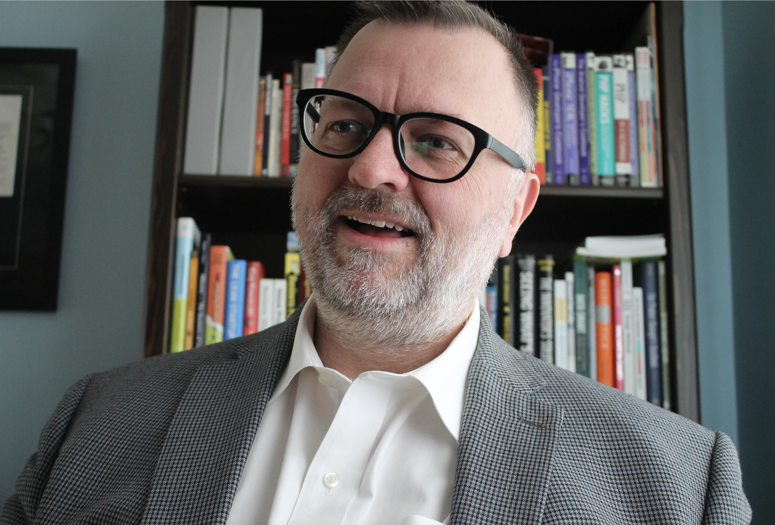 Andrew Opala, new CTO of Simmons Sharpe, looking scholarly.