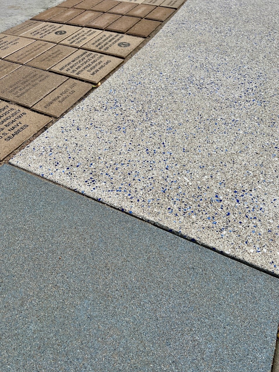White and blue exposed aggregate concrete