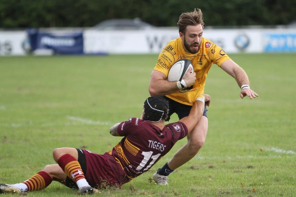 Connor Field Tackled By Jamie Harrison.jpg