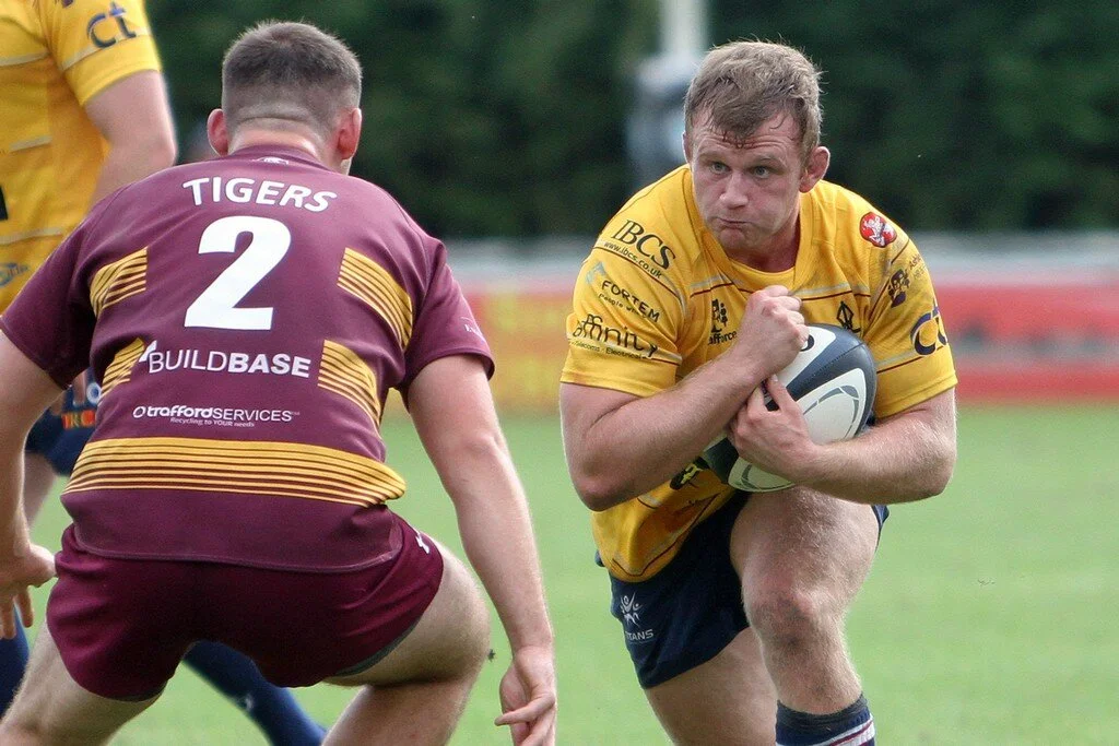 Harry Newborn Looks To Go Past Matt Speres.jpg