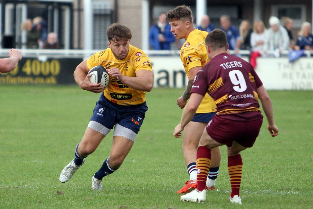 Jamie Cooke Looks To Go Past Daniel Openshaw.jpg