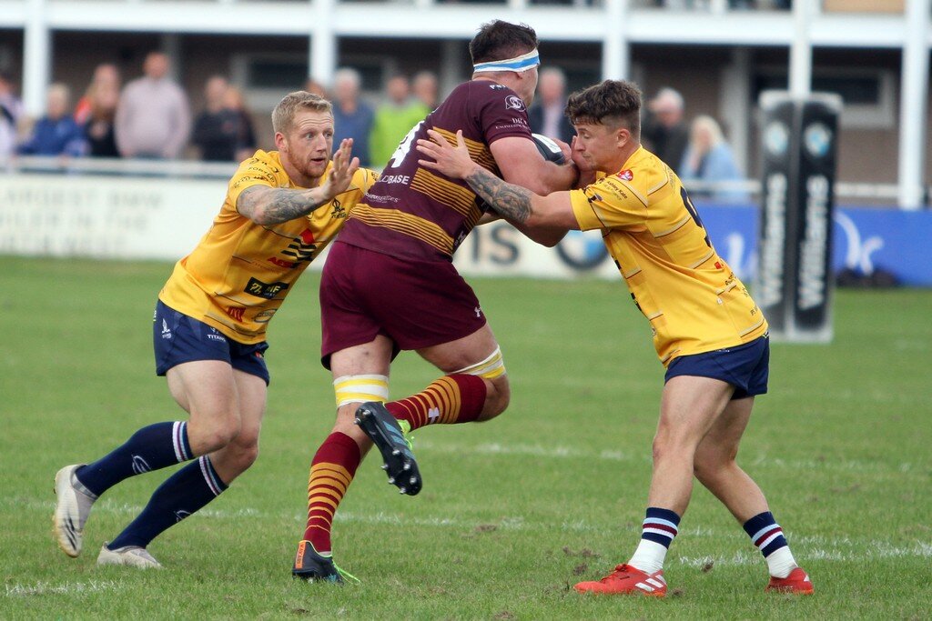 Lloyd Hayes and Sam Boxhall Tackle Robert Birtwell.jpg