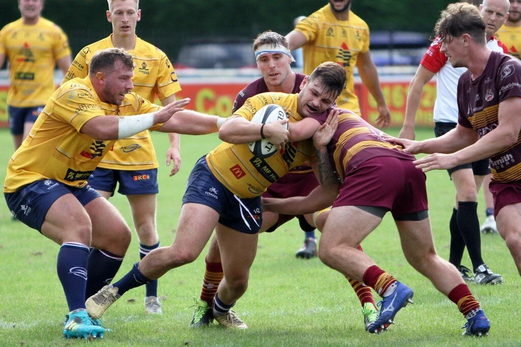 Matti Williams Tackled With Rikki Stout In Support.jpg