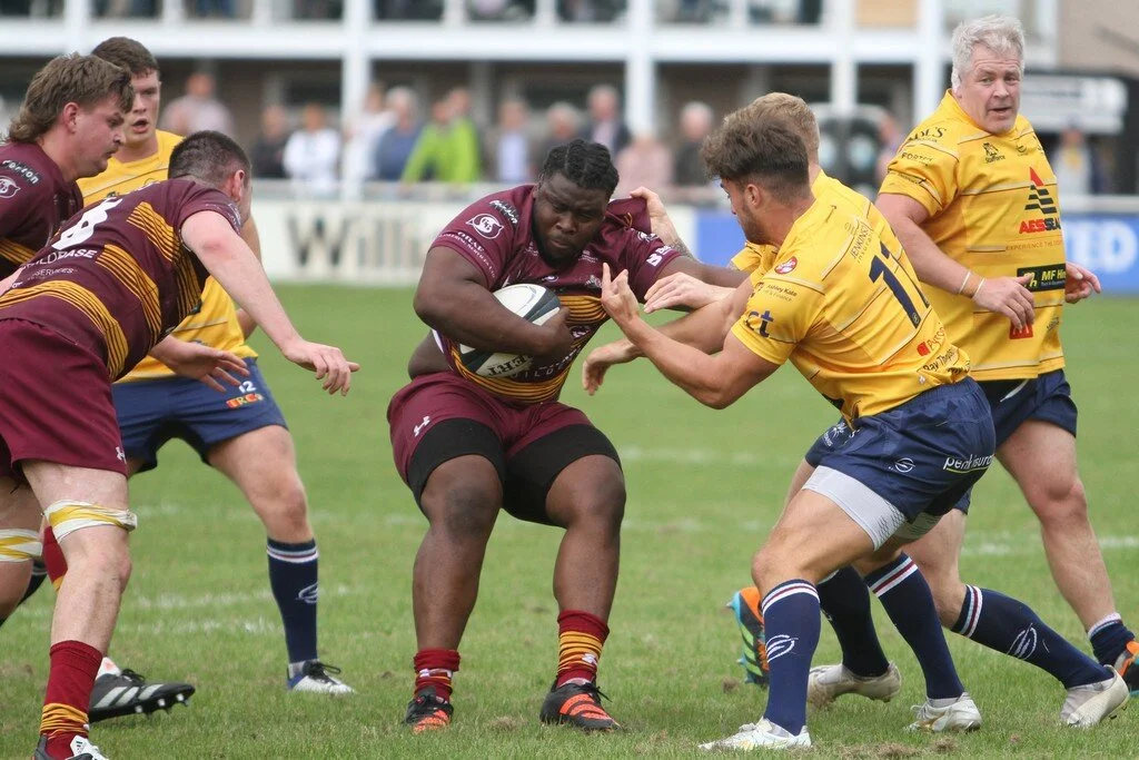 Sedgley Parks Nonleh Beltus is tackled by Jamie Cooke.jpg