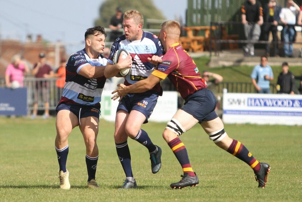 Joe Carlisle Breaks Through Tackle With Support From Matti Williams.jpg