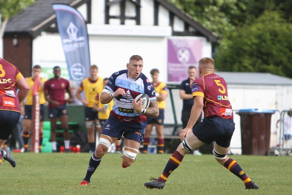 Matt Challinor Looks To Go Past Harry Dawson.jpg