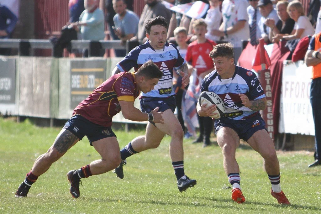 Sam Boxhall Prepares To Be Tackled With Cameron McDonald In Support.jpg