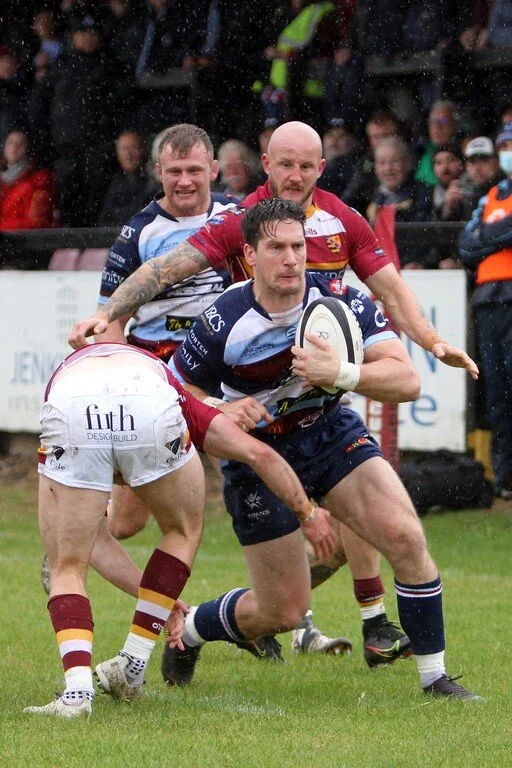 Mat Clark Tries To Break Out Of Tackle.jpg