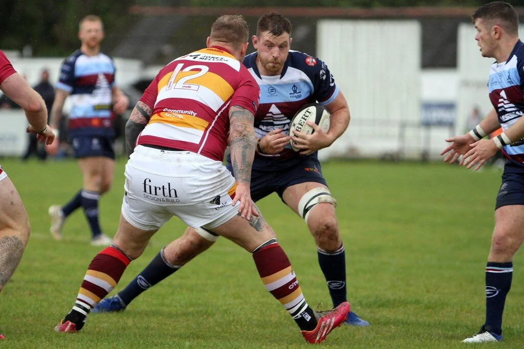 Matt Smith Looks To Go Past Scott Rawlings.jpg