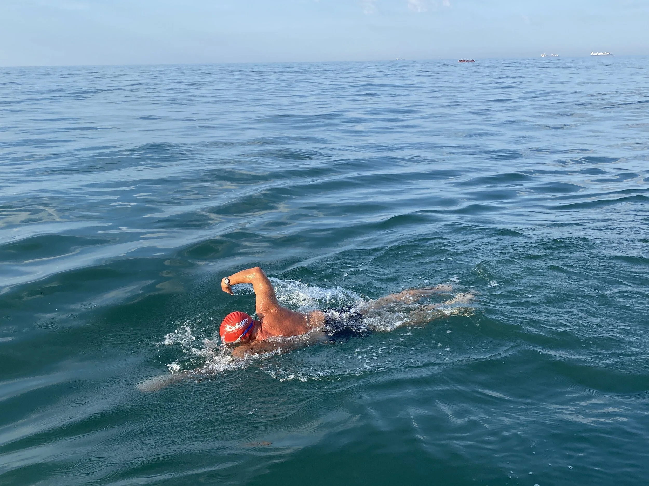 Zoom in on the small vessel on the horizon and you’ll see it’s a migrant boat