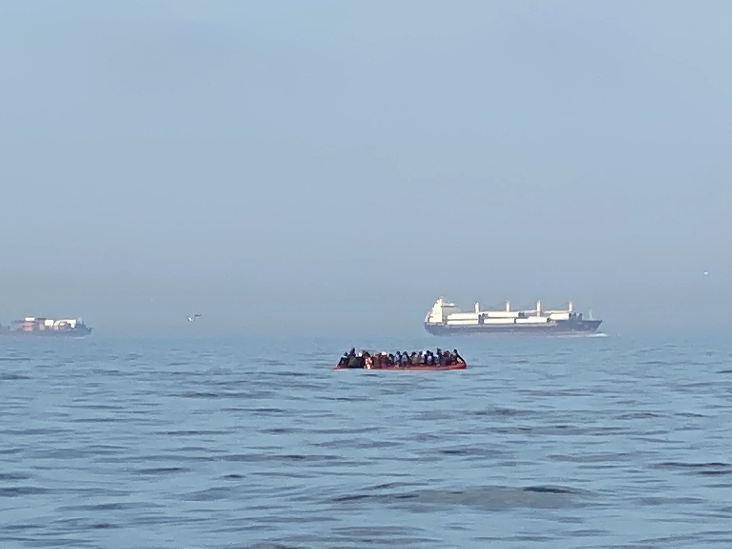 The sad sight of a migrant boat.  The dangers are evident - crossing a very busy shipping lane whilst not being very visible.