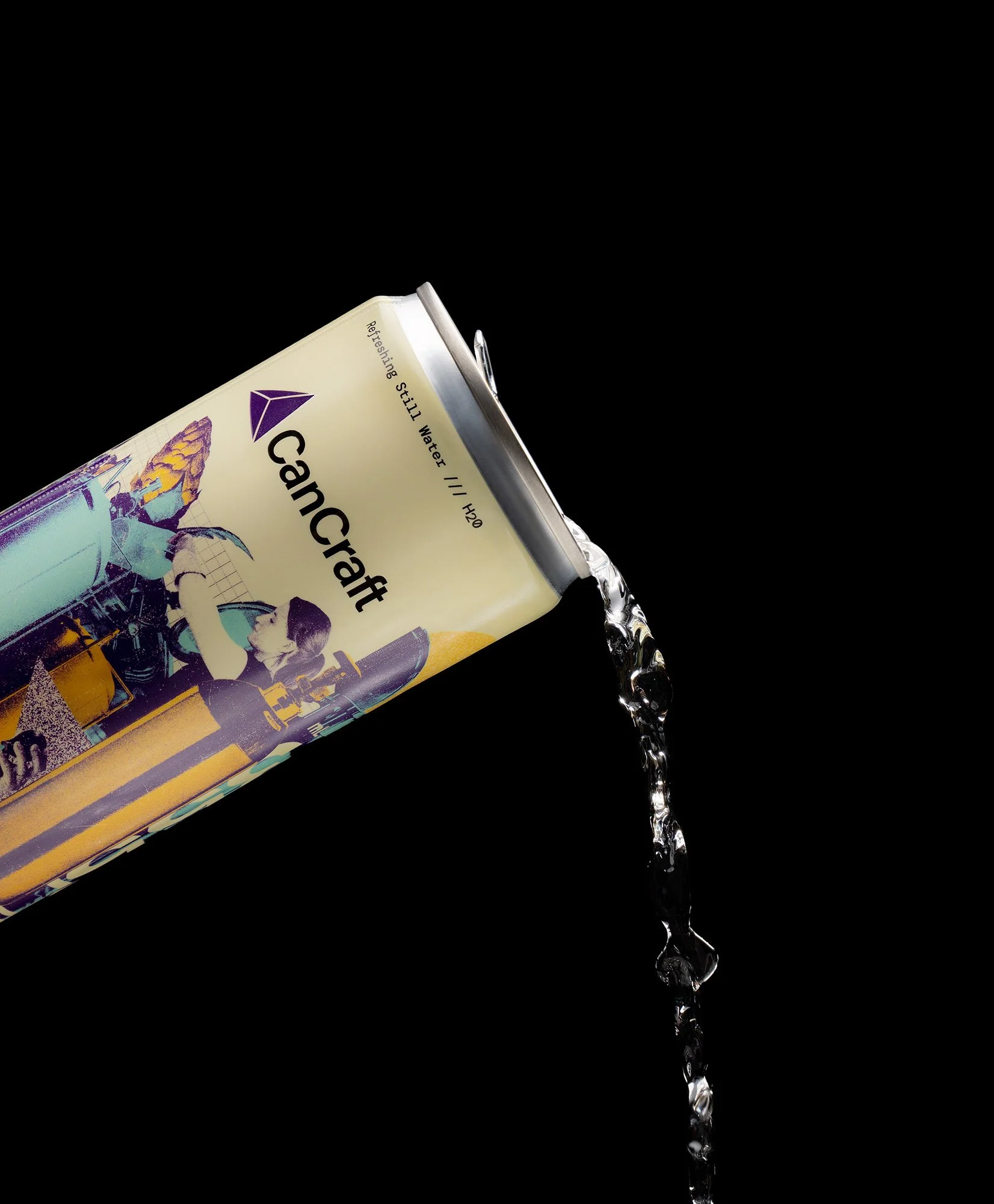 Close up packaging photography of a can of water being poured in front of a black background.