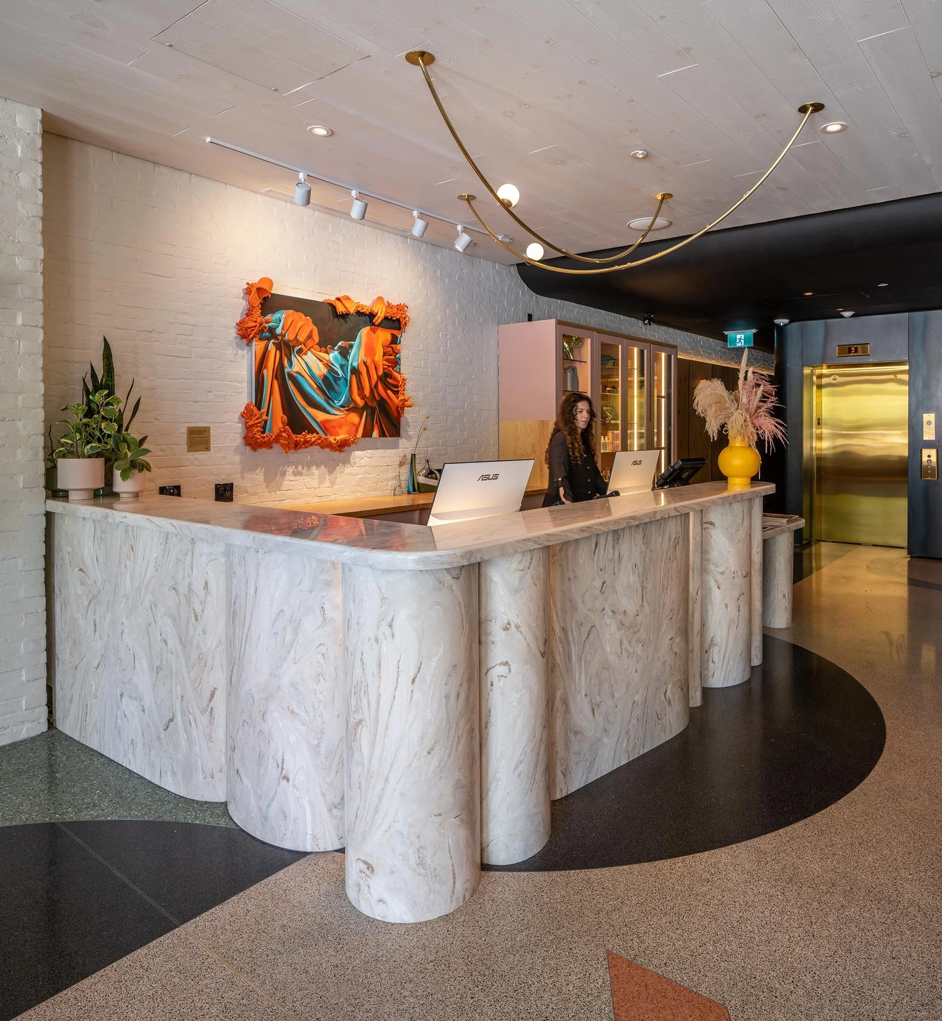 MId-century marble reception desk at the Drake Hotel.